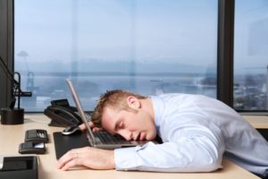 iStock_Guy-sleeping-on-computer